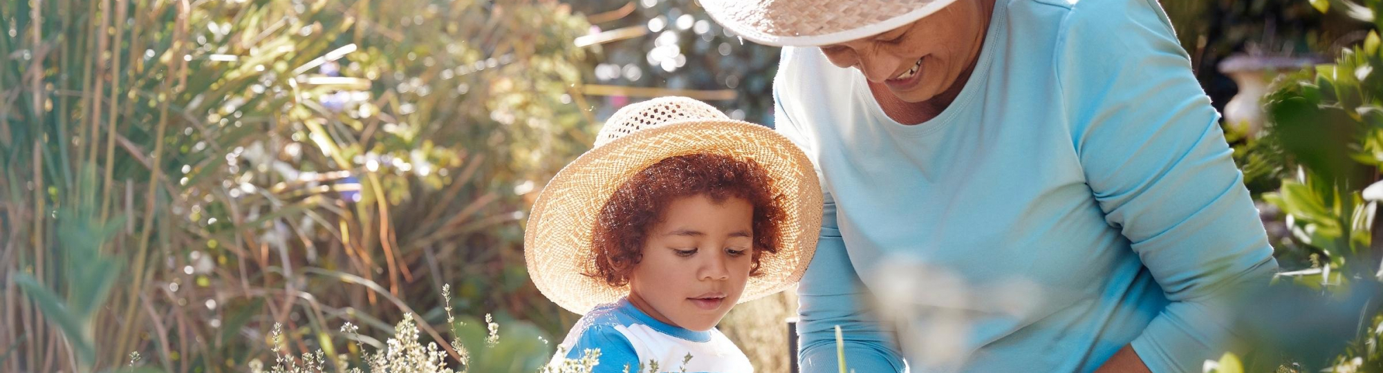 Grandmother and Granddaughter gardening together