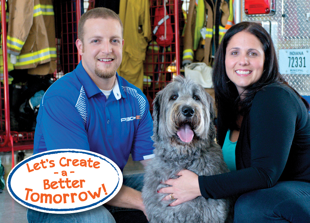 Couple with dog in fire station