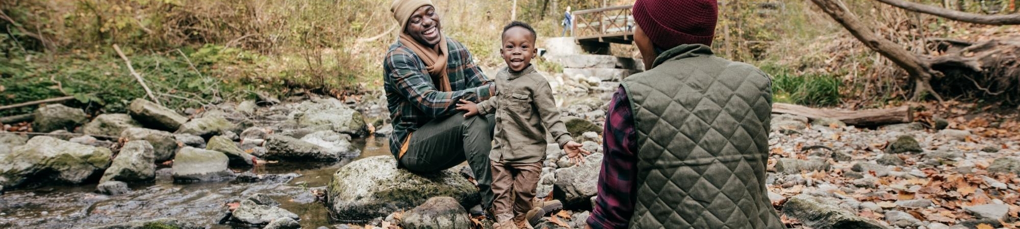 Family enjoying a creek