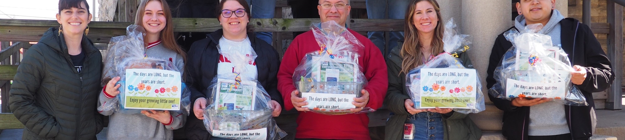 Group of Volunteers with Baby Baskets